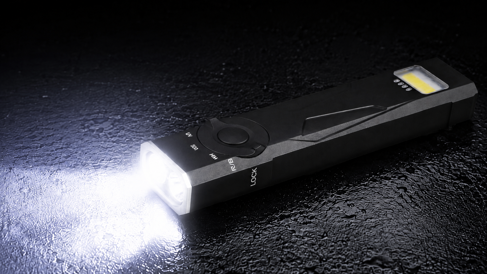 A black tactical LED flashlight with a bright white light turned on, casting a beam of light on a dark, wet surface. The flashlight has a circular control dial and a small yellow indicator window on its side.